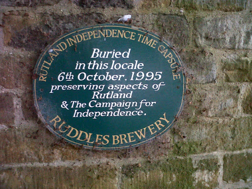 This plaque, on the wall of a small park SK8608 : Park in central Oakham, reads: "Rutland Independence Time Capsule. Buried in this locale 6th October 1995. Preserving aspects of Rutland and the...
