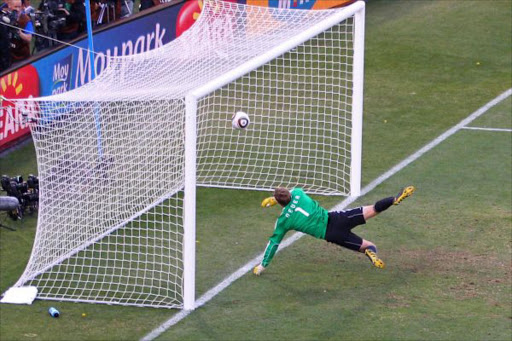 Manuel Neuer of Germany watches the ball bounce over the line from a shot that hit the crossbar from Frank Lampard of England, but referee Jorge Larrionda judges the ball did not cross the line during the 2010 FIFA World Cup South Africa Round of Sixteen match between Germany and England at Free State Stadium on June 27, 2010 in Bloemfontein
