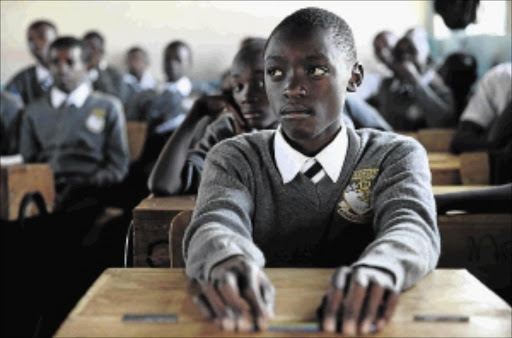 knowledge is power: A boy attends a class, which is part of a programme to train boys to intervene when witnessing physical or sexual assault, at a school in Nairobi, Kenya photo: Katy Migiro/REUTERS