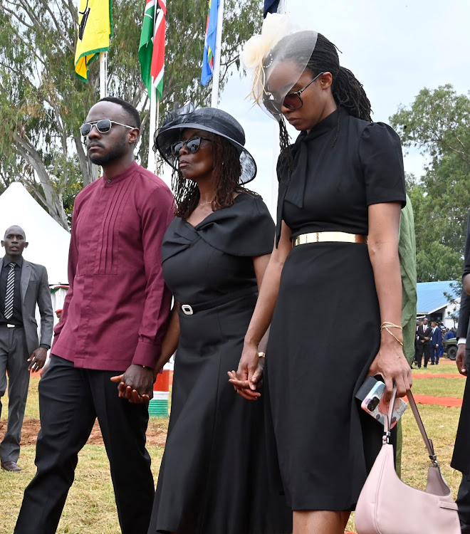 Family of the late CDF General Francis Ogolla; his wife Aileen, son Joel and daughter Lorna, during his burial ceremony at his home at Ngiya Village in Siaya County on April 21, 2024.
