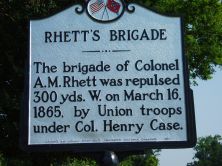 The brigade of Colonel A. M. Rhett was repulsed 300 yds. W. on March 16, 1865, by Union troops under Col. Henry Case.Plaque via North Carolina Highway Historical Marker Program, and is used with...