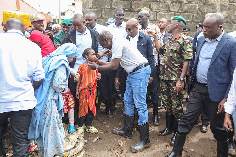 President William Ruto interacts with flood victims in Kiamaiko on April 6, 2024.