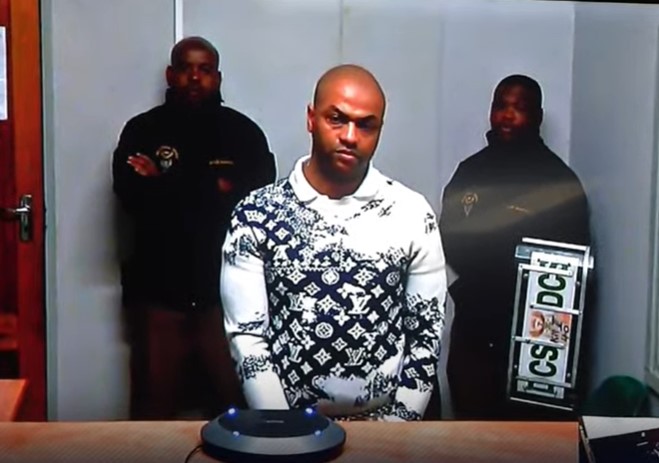 Rapist and murderer Thabo Bester wearing a Monogram Bandana motif crewneck sweatshirt by Louis Vuitton valued at more than R20,000.
