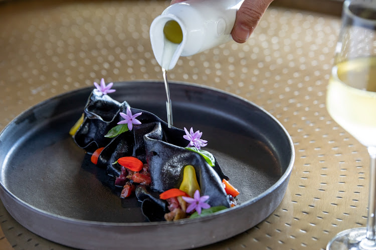 The "Black Pasta" is tossed in Mediterranean flavours of olives, red onion, capers, tomato salsa, fresh herbs, fresh cherry tomatoes and extra virgin olive oil.