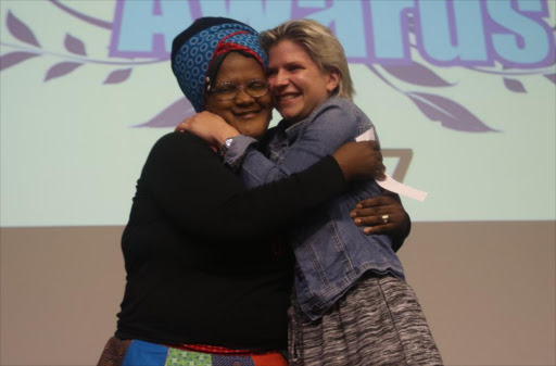 UPLIFTING: Nozie Mswi and Taralyn McLean of Rising Sun Daycare Centre in Duncan Village accepting their prize at the ForGood Inspiration Awards ceremony yesterday Picture: MICHAEL PINYANA