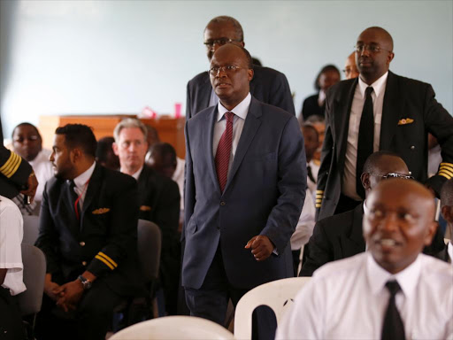 Transport CS James Macharia with Board Chairman Dennis Awori and Kenya airlines pilots association Secretary Gen Paul Githinga (R) during their meeting at Rubani house on april 28, 2016. Photo/JACK OWUOR