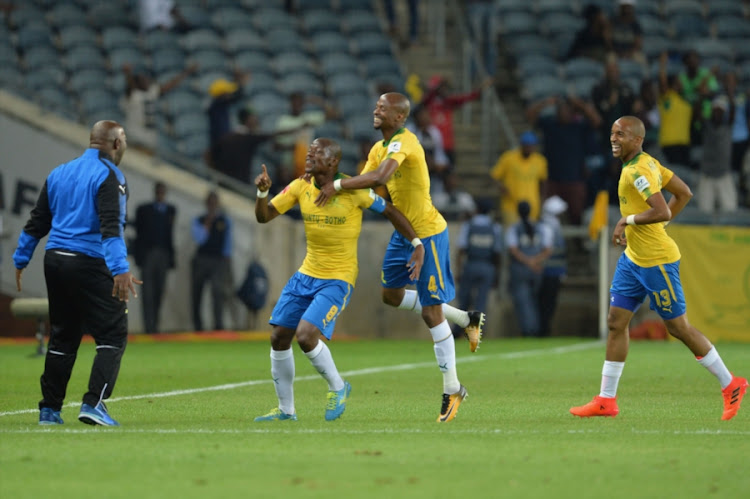 Pitso Mosimane (Coach), Hlompho Kekana, Tebogo Langerman and Tiyani Mabunda of Mamelodi Sundowns celebrates a goal during the Absa Premiership match between Orlando Pirates and Mamelodi Sundowns at Orlando Stadium on November 01, 2017 in Johannesburg, South Africa.