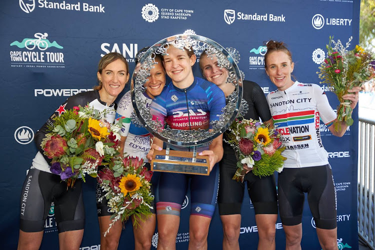 Tiffany Keep savours her victory in the Cape Town Cycle Tour with her competitors. Picture: CHRIS HITCHCOCK