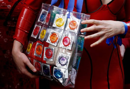 A sex worker holds a bag with condoms. File picture.