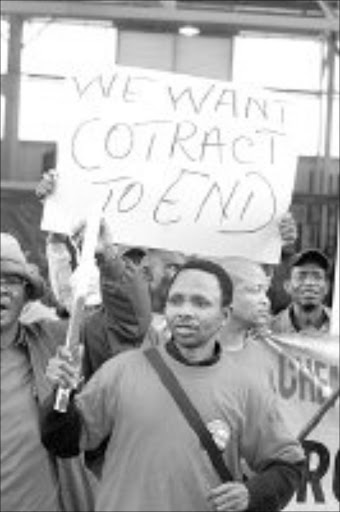PROTEST ACTION: Cosatu workers on strike in Industria West Johannesburg, yesterday. Pic. Antonio Muchave. 01/10/07. © Sowetan.