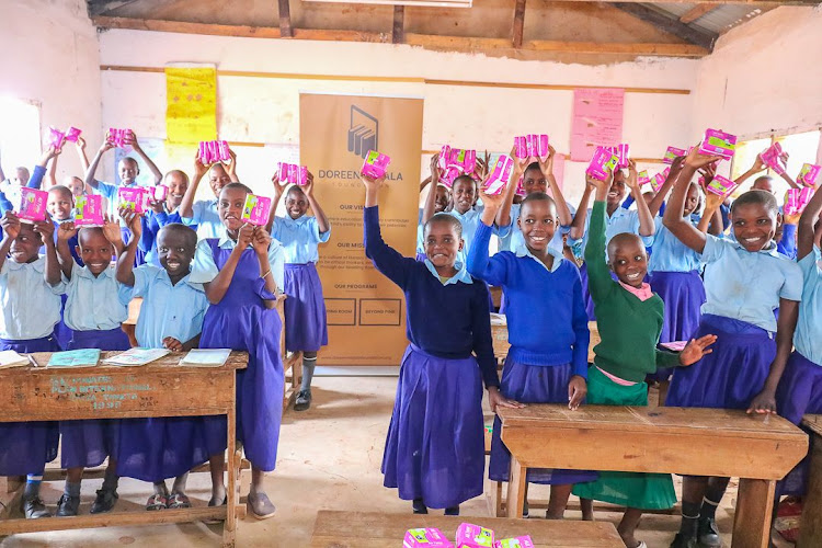 Girls at Mariwenyi Primary school in Voi receive sanitary pads after a mentorship program by DMF.