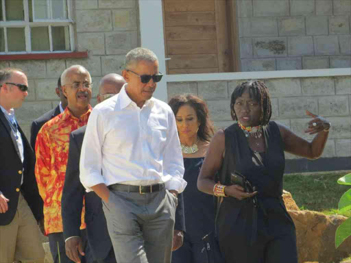 Former US President Barack Obama with his half sister Auma at Sauti Kuu Foundation, which he helped to launch, in K'Ogelo, Siaya county, July 16, 2018. /LAMECK BARAZA