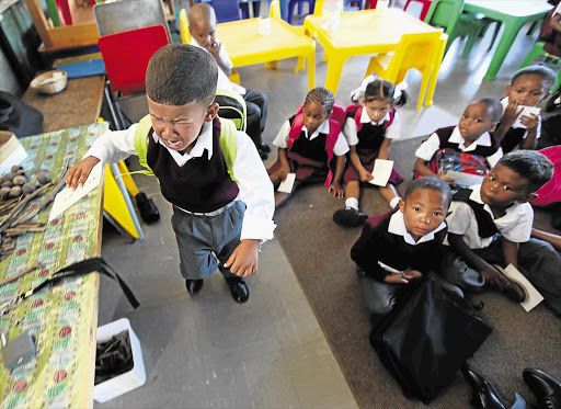 Zinedene Williams, 5, cries for his mom on his first day at school at Morgenson Primary in Hanover Park, Cape Town, yesterday See Page 4 Picture: ESA ALEXANDER