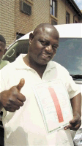 A HAPPY MAN: musician Steve "Malo-a-Botsheba" Sefofa. Pic. Elijar Mushiana. 20/10/2009. © Sowetan. 20 OCTOBER 2009 TUESDAY: Taxi owner Steven Sefufa received the operating licence from the department of Roads and Transport after it was impounded by traffic officer last week Sunday. PHOTO: ELIJAR MUSHIANA
