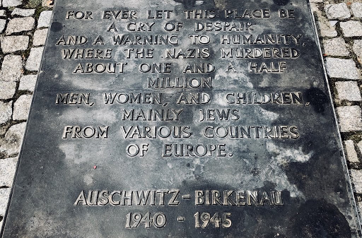 FOR EVER LET THIS PLACE BE A CRY OF DESPAIR AND A WARNING TO HUMANITY, WHERE THE NAZIS MURDERED ABOUT ONE AND A HALF MILLION MEN, WOMEN, AND CHILDREN MAINLY JEWS FROM VARIOUS COUNTRIES OF EUROPE....