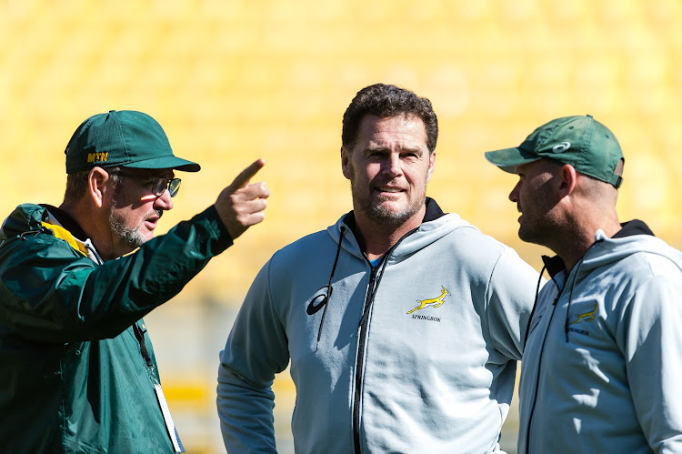 Springboks head coach and director of rugby Rassie Erasmus (C) is flanked by his coaching staff
