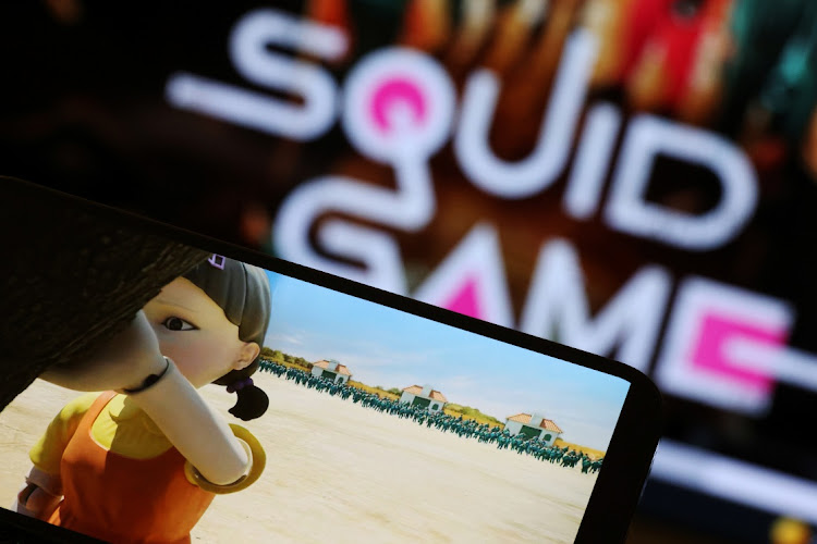The Netflix series ‘Squid Game’ is played on a mobile phone in this illustration. Picture: REUTERS/KIM HONG-JI