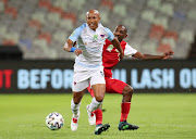 Kurt Lentjies of Chippa United challenged by Thabo Rakhale of Tshakhuma FC during the 2021 Nedbank Cup Final match between Tshakhuma FC and Chippa United at the Free State Stadium in Bloemfontein.