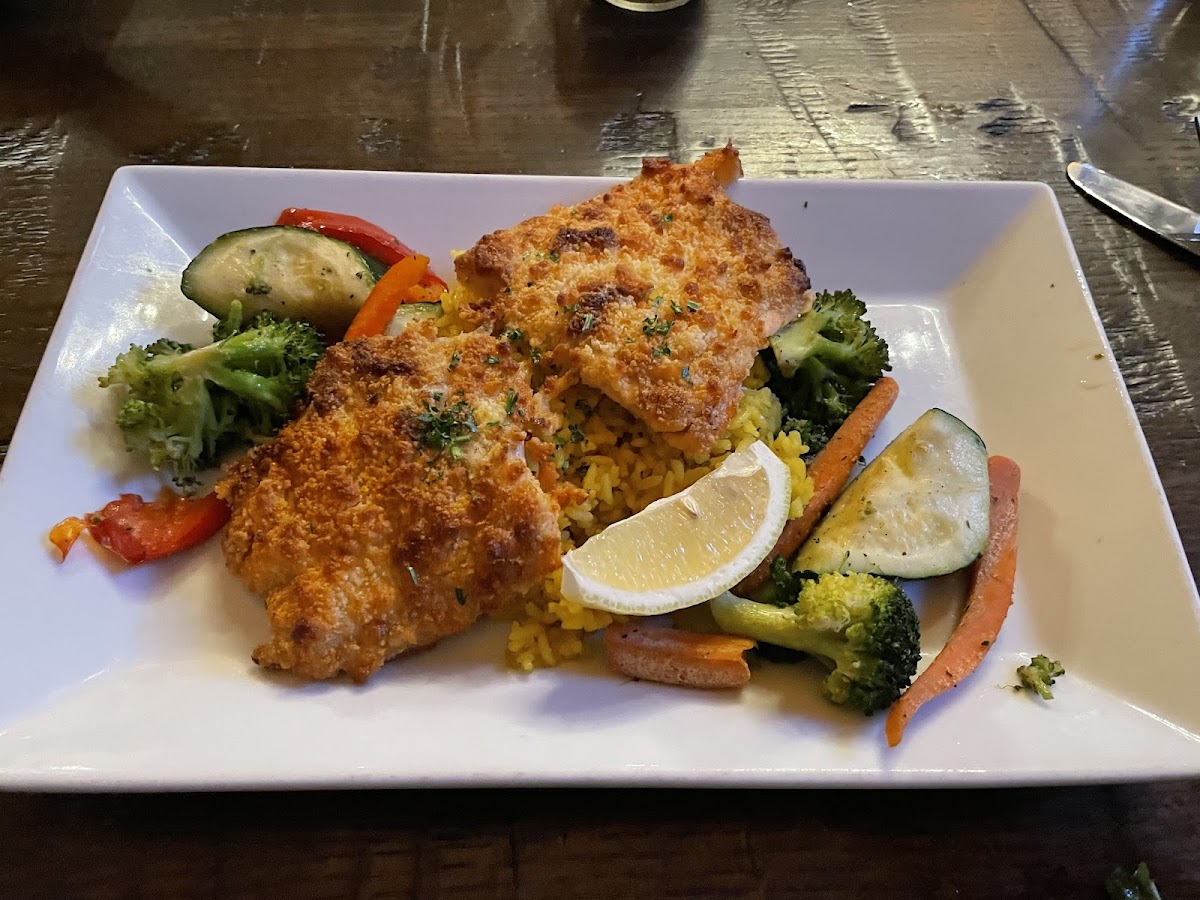 Parmesan crusted salmon with rice pilaf and "vegetable garnish"