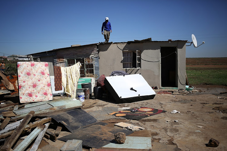 . A clean up underway. Putfontein, Benoni. The informal community behind the Putfontein Police Station was badly affected by a storm that ripped through parts of Johannesburg on 09 October 2017.