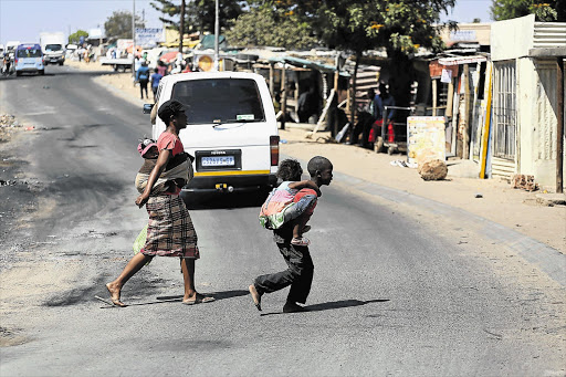 SURFACE CALM: Diepsloot was quiet yesterday after angry residents took to the streets and blocked roads in the township on Tuesday following the discovery of the bodies of two murdered toddlers