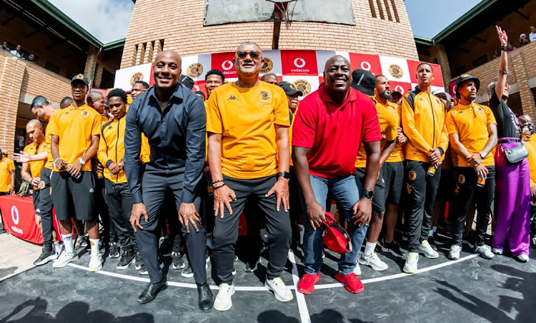 Kaizer Chiefs players , caretaker coach Cavin Johnson, director of football Kaizer Motaung Junior, and Vodacom CEO Sitho Mdlalose at yesterday’s back to school activation in Tembisa. Pic: Opnenfield Marketing