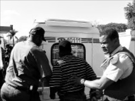 COPS ACT: Jeffrey 'Manjaro' Senyolo, a municipal councillor and ANC official, arrested after police said he organised an illegal march outside ANC offices. Pic. Alex Matlala. 22/06/08. © Sowetan.