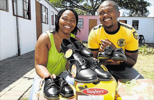 GOOD CAUSE: JANUARY 12, 2016 Buyiswa Jonas owner of God’s Heart Desire orphanage in Fort Jackson with Lwando Mjevu of Loud Noise Entertainment who handed over brand new school shoes to the orphanage