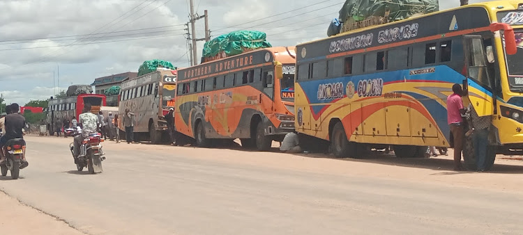 Commuter buses plying to Garissa,Wajir and Mandera packed at Madogo area after flash floods destroyed the Kona Punda-Mororo section.