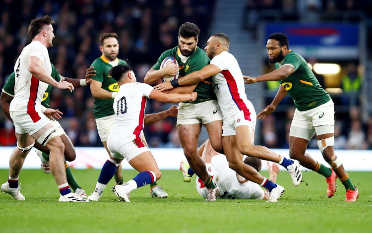 Joe Marchant of England tackles Damian de Allende on Saturday at Twickenham in London. Picture: STEVE HAAG/GALLO IMAGES