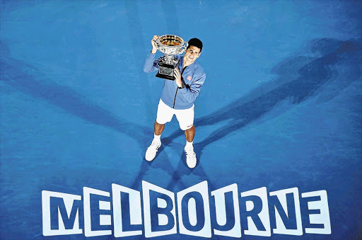 FOR THE RECORD: Novak Djokovic beat Andy Murray to claim his fifth Australian Open title in Melbourne, Australia yesterday. Djokovic himself set a record for most Australian Open titles in the Open era, one behind Roy Emerson