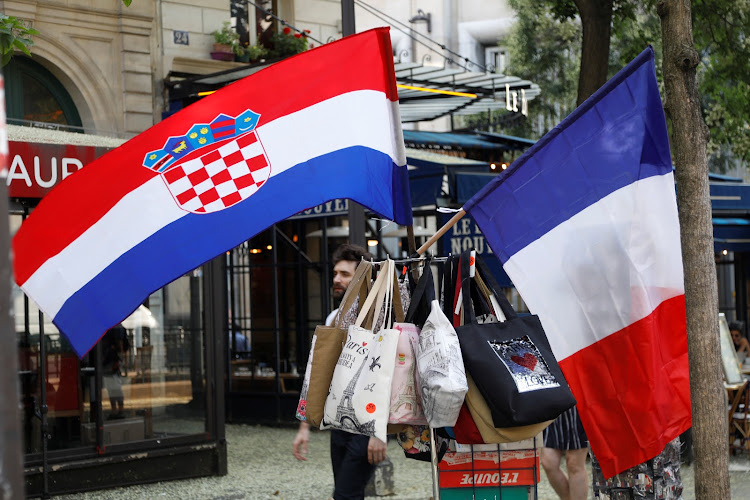 A Croatian flag and a French flag on sale at a kiosk in Paris prior to the 2018 World Cup final between France and Croatia.