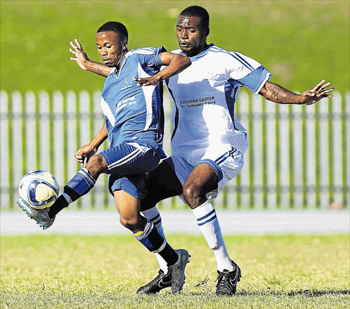 BLOCKED: Zwelitsha United’s Odwa Nzamela, left, keeps the ball away from Relatives' Patrick Nguengue during yesterday’s club final at Jan Smuts Stadium Picture: MARK ANDREWS