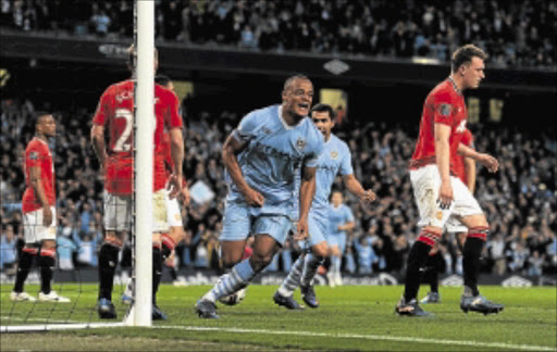 DECISIVE BLOW: Vincent Kompany of Manchester City celebrates scoring the game's only goal in Monday's Premier League match against United. PHOTO: GETTY IMAGES