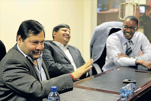 Ajay and Atul Gupta with their partner, Duduzane Zuma. Gupta family may regain control of the lucrative assets. Picture: FILE
