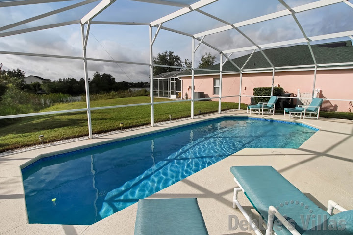 South-facing private pool with lake view at this villa in Davenport