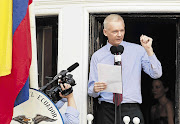 WikiLeaks founder Julian Assange, speaking from the Ecuadorean embassy in London, calls on US President Barack Obama to end the 'witch-hunt' against WikiLeaks. File photo.