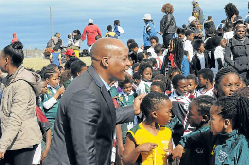 BUILDING UP: Premier of the Eastern Cape, Phumulo Masualle, visited Umzuvukile Sport Development Women’s celebrations event in Mdantsane yesterday, where about 900 young girls played rugby as part of a gender-based anti-violence programme Picture: RANDELL ROSKRUGE
