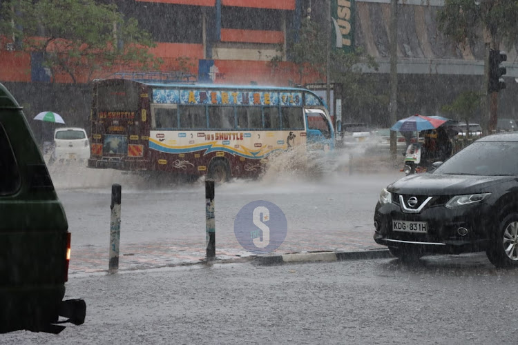 Nairobi residents brave heavy evening rainfall on March 23, 2023 .