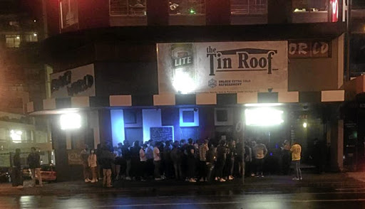 Patrons queue outside the Tin Roof club in Claremont, Cape Town, just days before a superspreading event unfolded there.