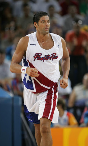 Jose Ortiz of Puerto Rico jogs in the men's basketball preliminary game against the United States on August 15, 2004 during the Athens 2004 Summer Olympic Games at the Indoor Arena of the Helliniko Olympic Complex in Athens, Greece. Puerto Rico won 92-73