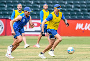 Dale Steyn (R) and Wiaan Mulder (L) of the Proteas take part in a football session during the South African national cricket team training session and interviews at Bidvest Wanderers Stadium on September 27, 2018 in Johannesburg.   