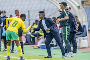 Karabo Dlamini of South Africa celebrates with coach Simphiwe Dludlu of South Africa after scoring a goal during the U17 World Cup Qualifier match between South Africa and Morocco at Dobsonville Stadium on February 04, 2018 in Johannesburg.
