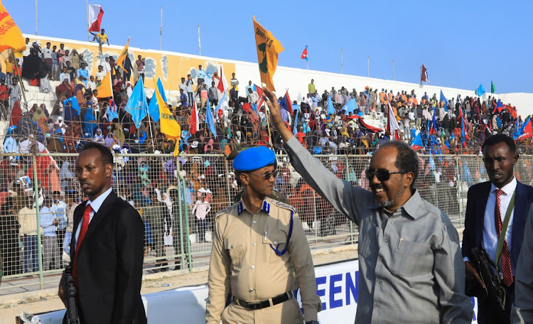 Somalia's President Hassan Sheikh Mohamud waves to supporters as he arrives to a rally dubbed "Mogadishu People’s Uprising" in Mogadishu, Somalia January 12, 2023.