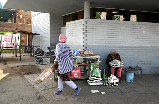 A scene outside a tavern in Katlehong where a mob assaulted parademics forcing them to take a death body./SANDILE NDLOVU