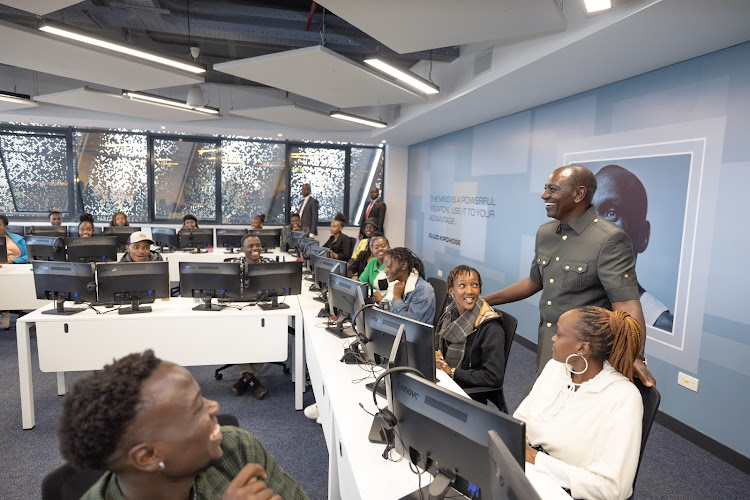 President William Ruto shakes interacts with the staff at the Call Centre International(CCI) Global Contact Centre, Tatu City, Kiambu County during its launch on May 10, 2024.