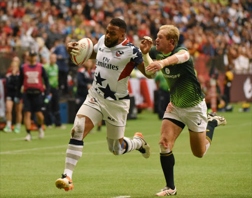 South Africa (green) and USA (white) compete in the HSBC Canada Sevens Series Rugby Vancouver Tournament at BC Place Stadium in Vancouver, March 12, 2017.