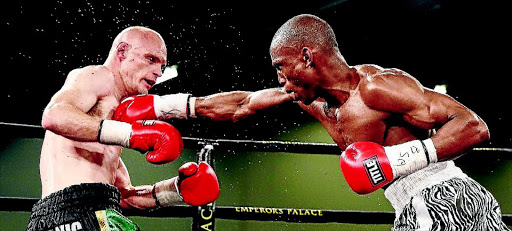 SPARKS FLY: SA welterweight champion Shaun Ness and Ayanda Mthembu exchange leather during their brutal 12-rounder which was won by Ness on points at Emperors Palace on Sunday afternon PHOTO: Nick Lourens