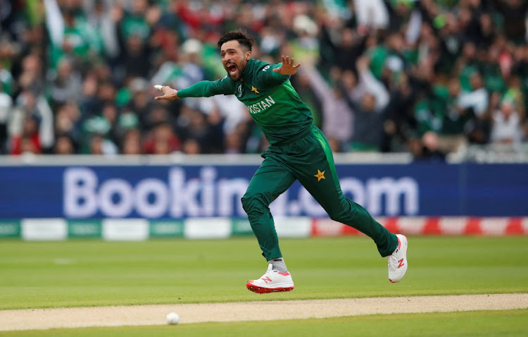 Pakistan's Mohammad Amir celebrates taking the wicket of New Zealand's Martin Guptill in an ICC Cricket World Cup match against New Zealand at Edgbaston in Birmingham in June 2019.