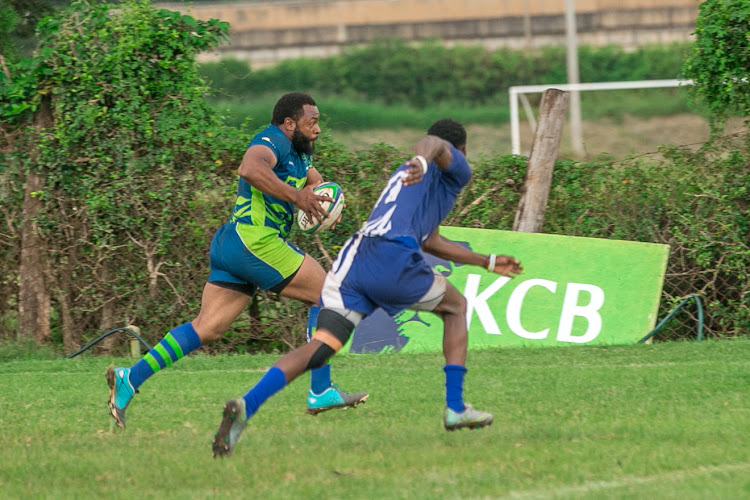 Captain Griffin Musila runs with the ball during a Kenya Cup match against Leos at the KCB Sports Club, Ruaraka on January 20.